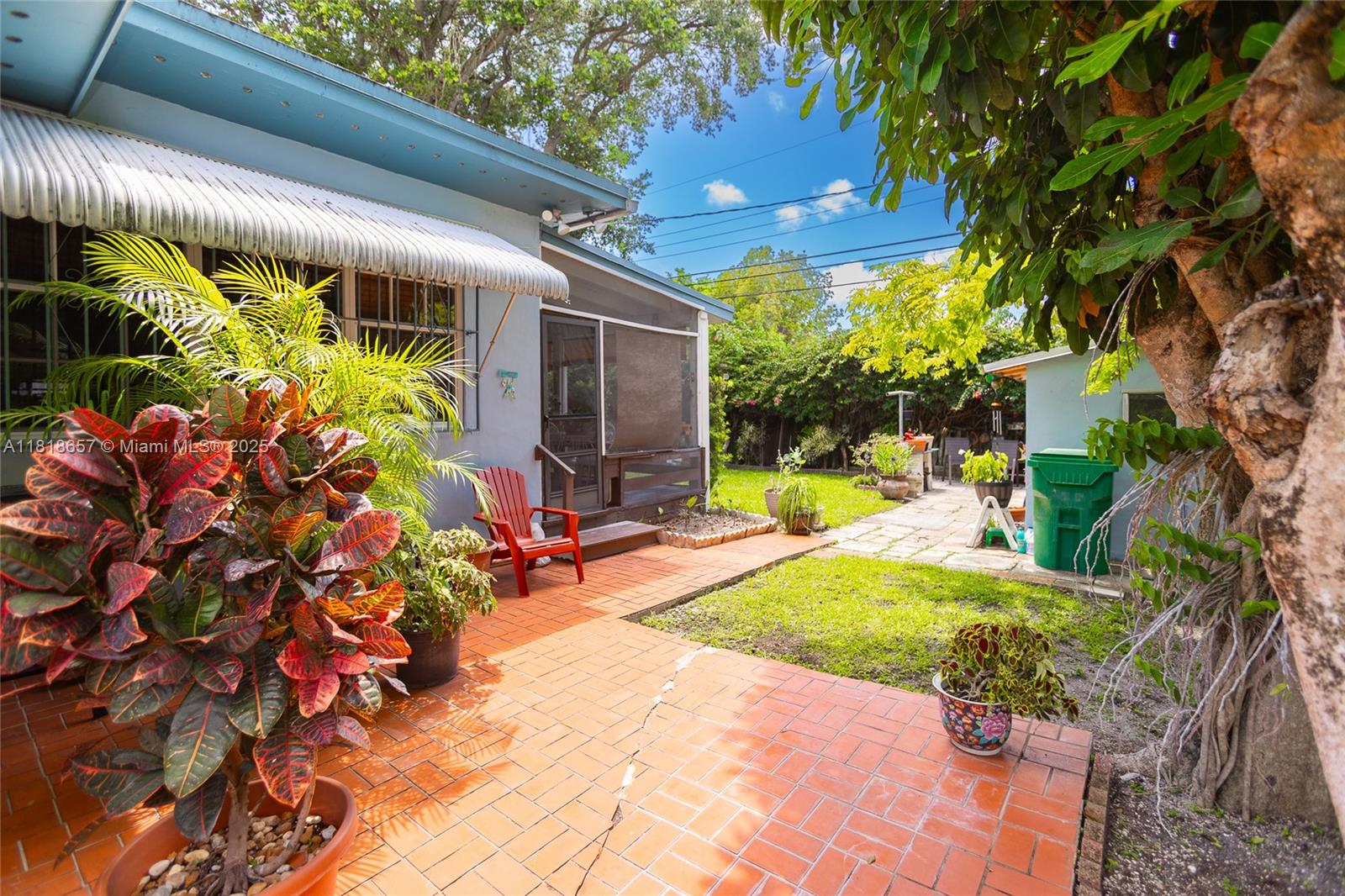 7110 Southwest 13th Terrace Miami, FL 33144 - Photo 41 of 48 a view of a backyard with plants and a patio