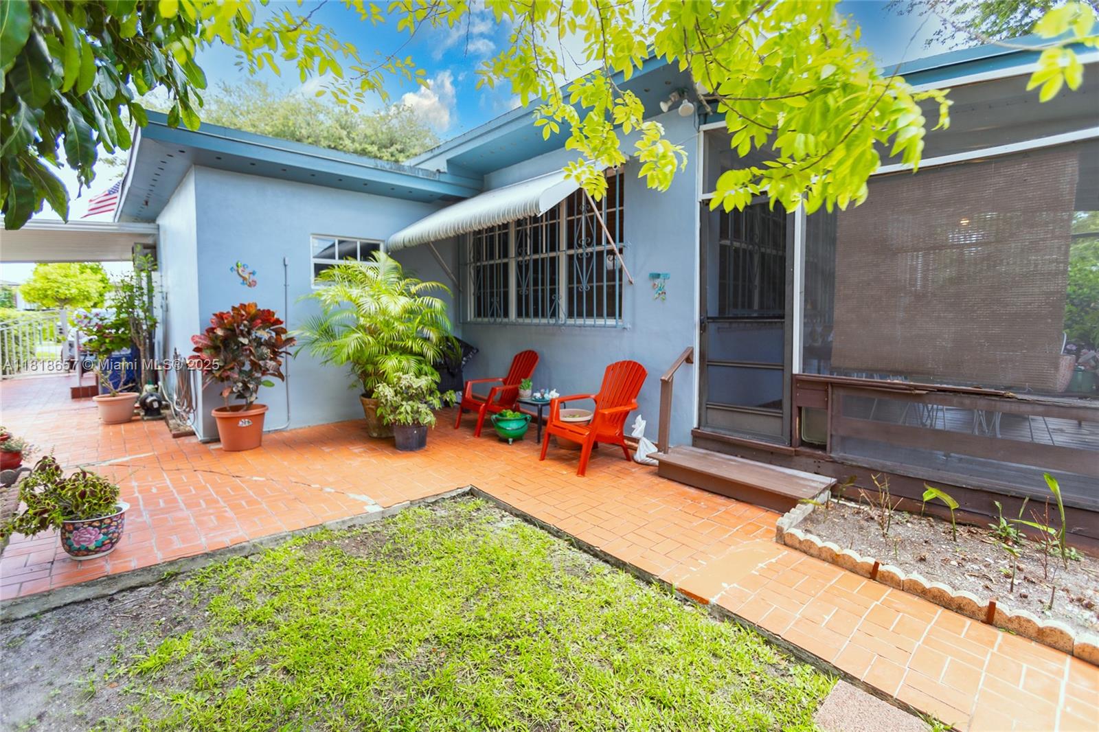 7110 Southwest 13th Terrace Miami, FL 33144 - Photo 42 of 48 a view of a backyard with plants and a patio