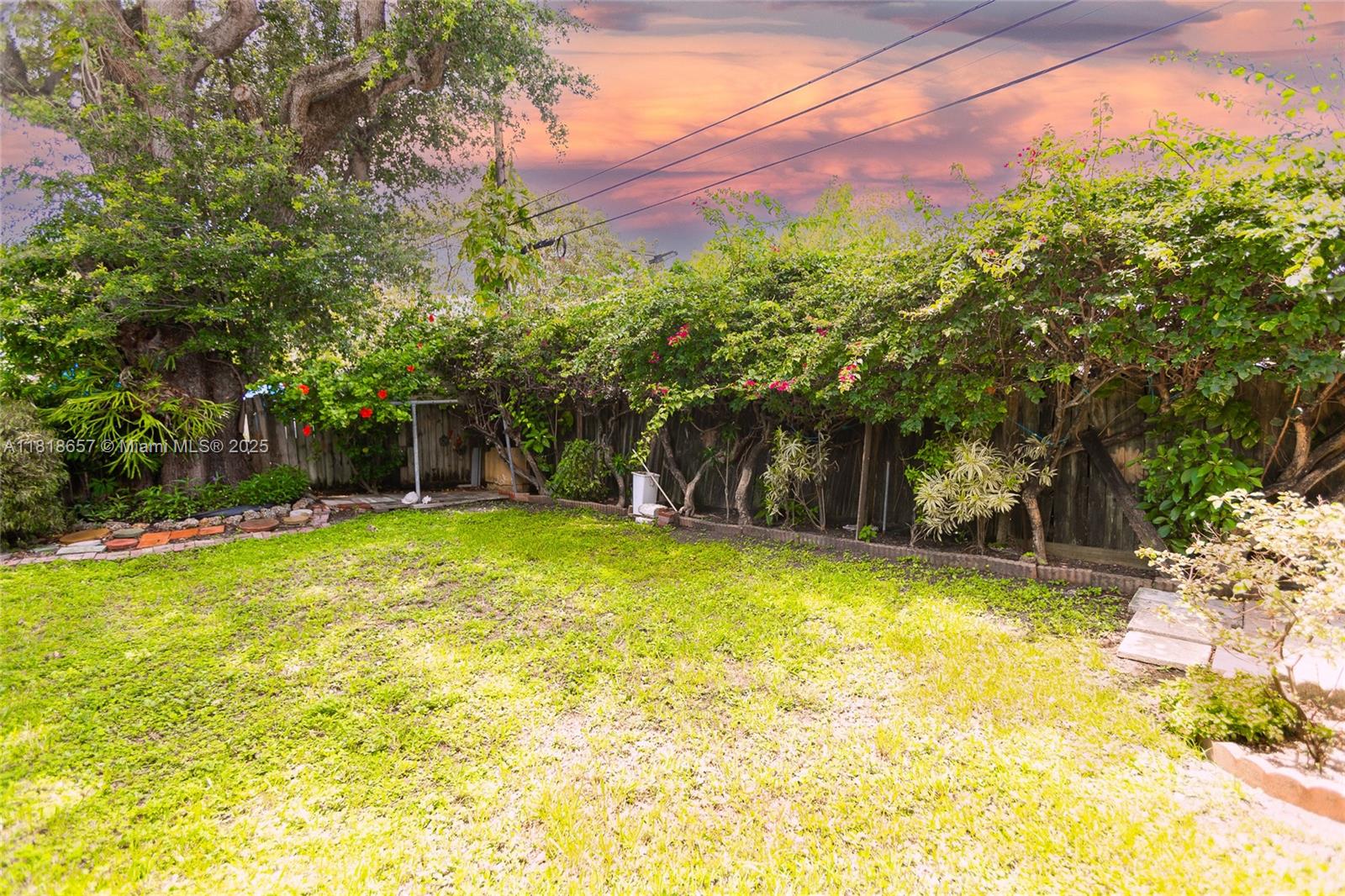 7110 Southwest 13th Terrace Miami, FL 33144 - Photo 44 of 48 a view of a swimming pool and a yard