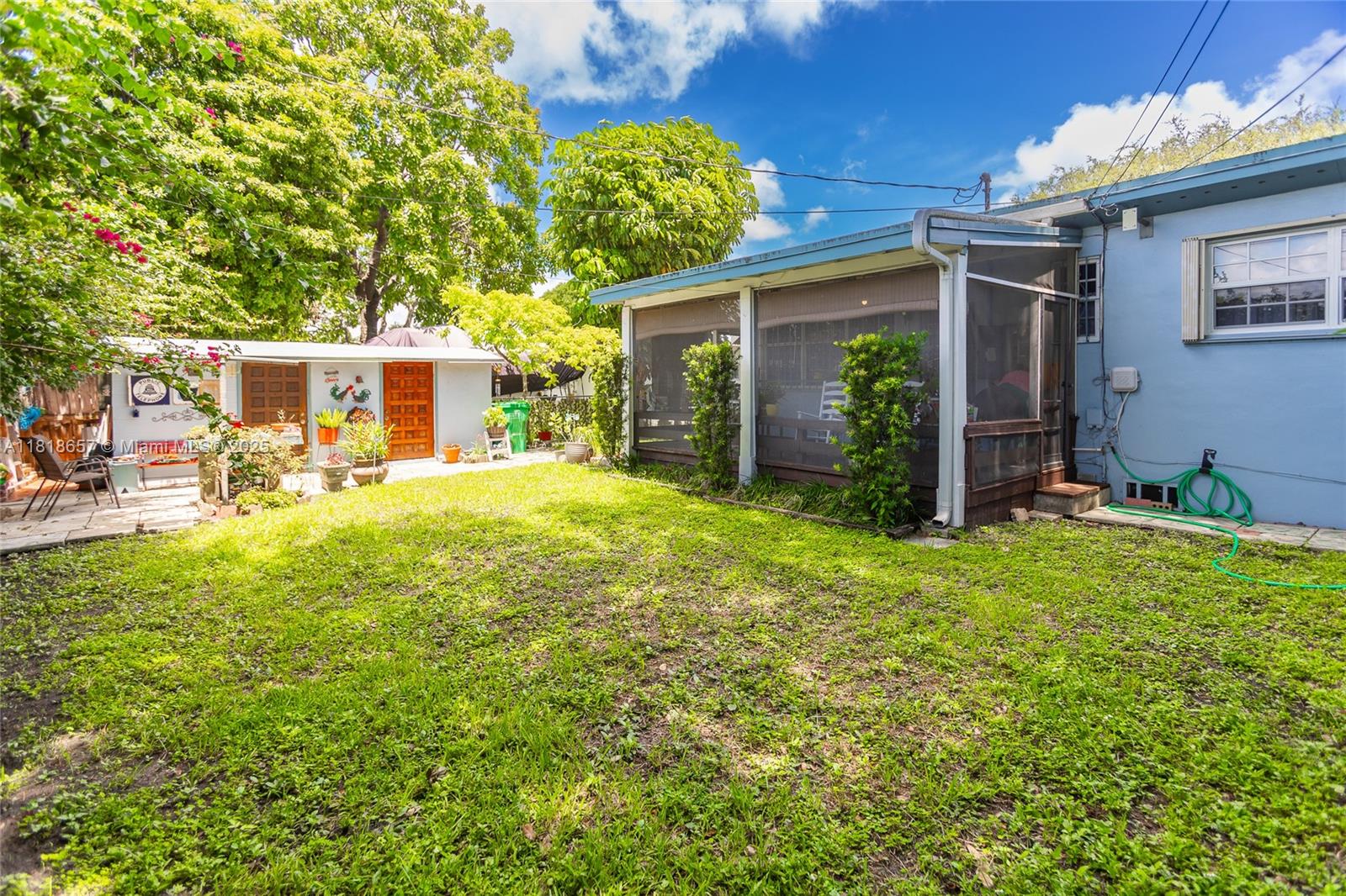 7110 Southwest 13th Terrace Miami, FL 33144 - Photo 45 of 48 a view of a house with backyard porch and sitting area
