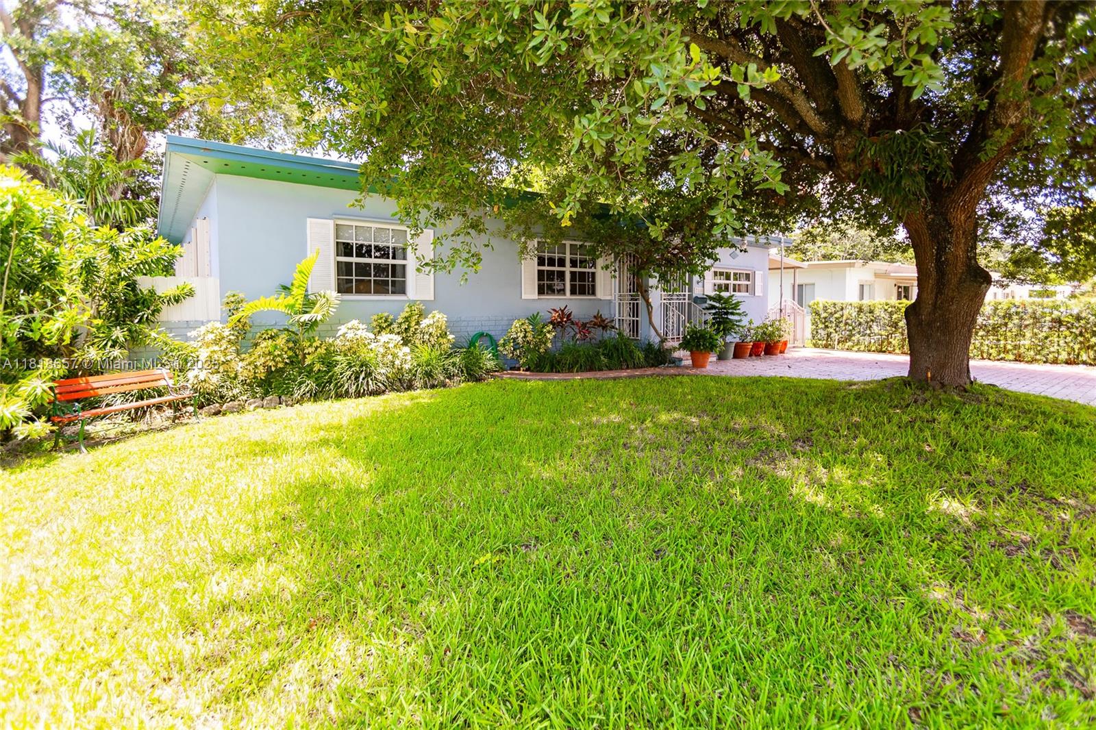 7110 Southwest 13th Terrace Miami, FL 33144 - Photo 6 of 48 a view of a house with a yard and tree s