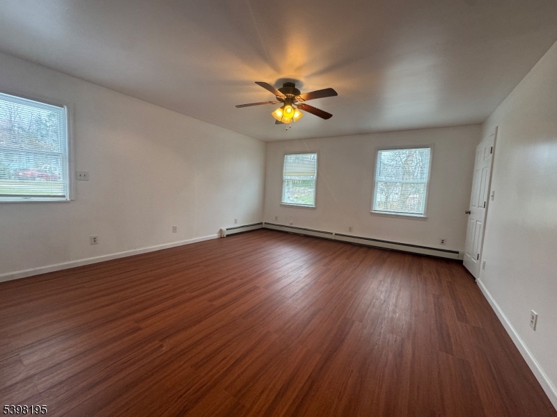 252 Wiscasset Road Vernon, NJ 07422 - Photo 7 of 10 a view of empty room with wooden floor and fan