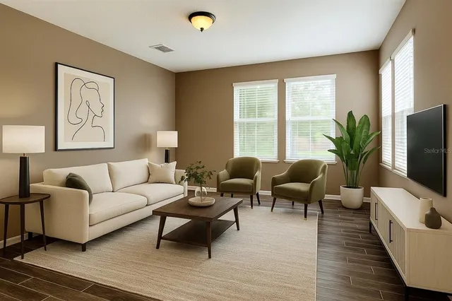 a living room with furniture and a flat screen tv