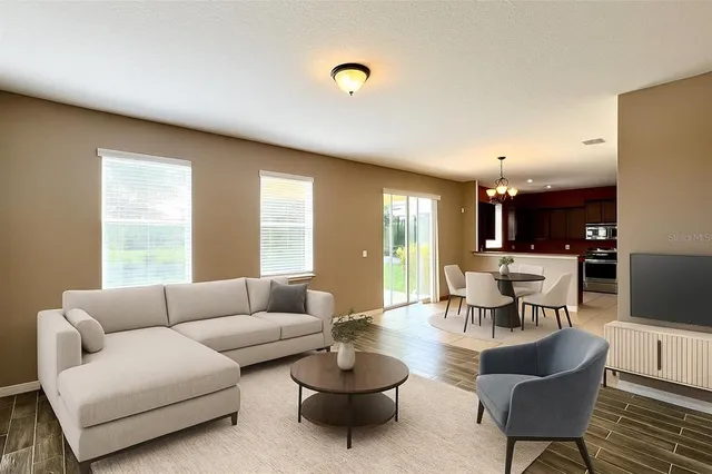 a bedroom with a bed and a couch