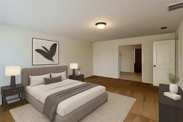 a bedroom with furniture and a window