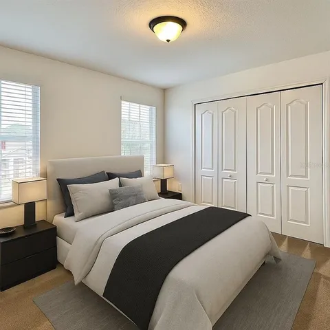 a white toilet sitting next to a shower