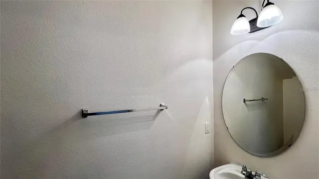 a view of a kitchen with a sink and a window