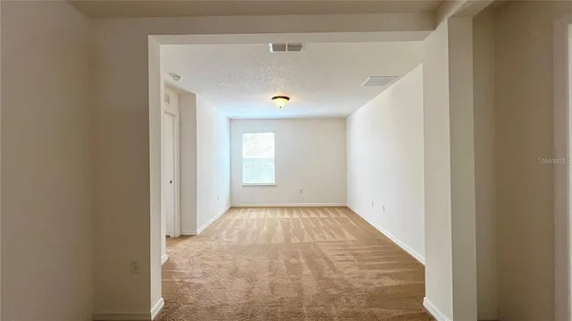 an empty room with windows and view