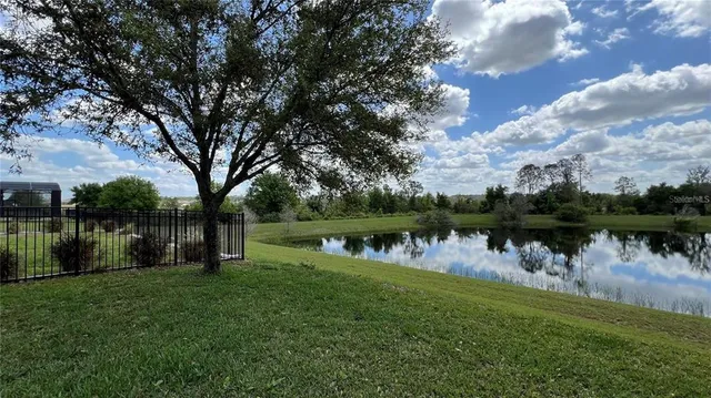 a view of entryway and gallery with wooden floor