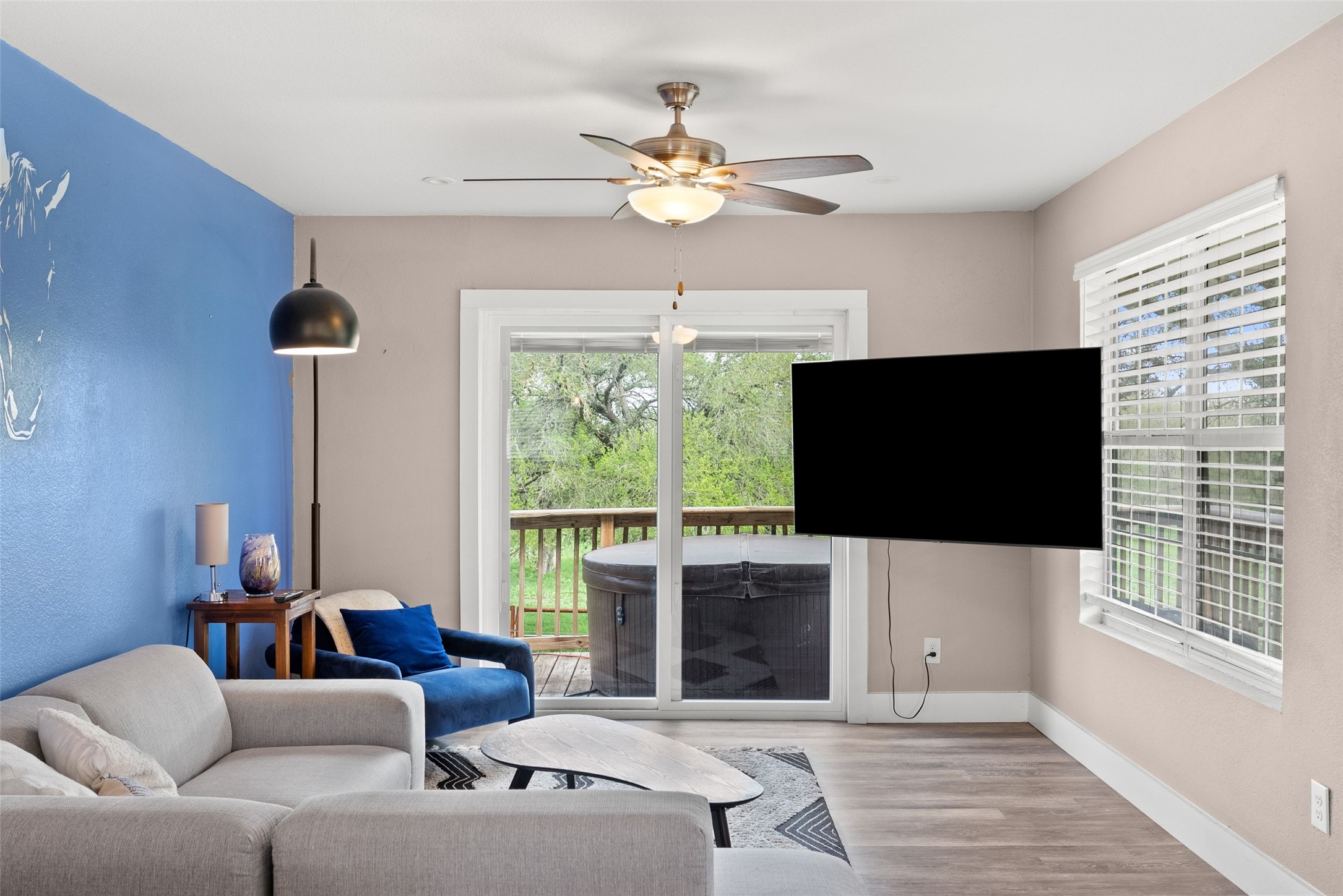 274 Old Austin Trail Elgin, TX 78621 - Photo 12 of 32 a living room with furniture a flat screen tv and a large window