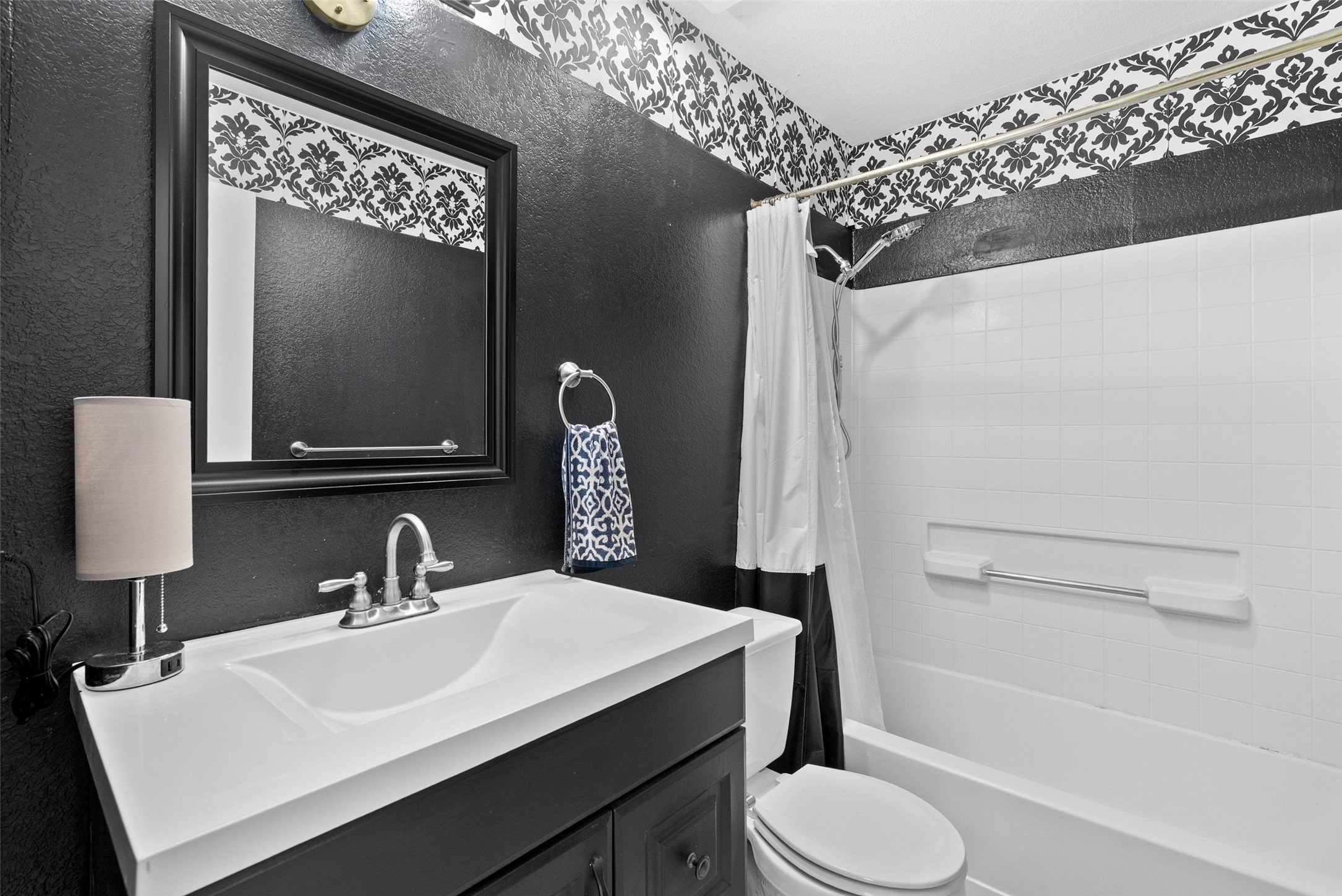 274 Old Austin Trail Elgin, TX 78621 - Photo 21 of 32 a bathroom with a sink toilet and shower