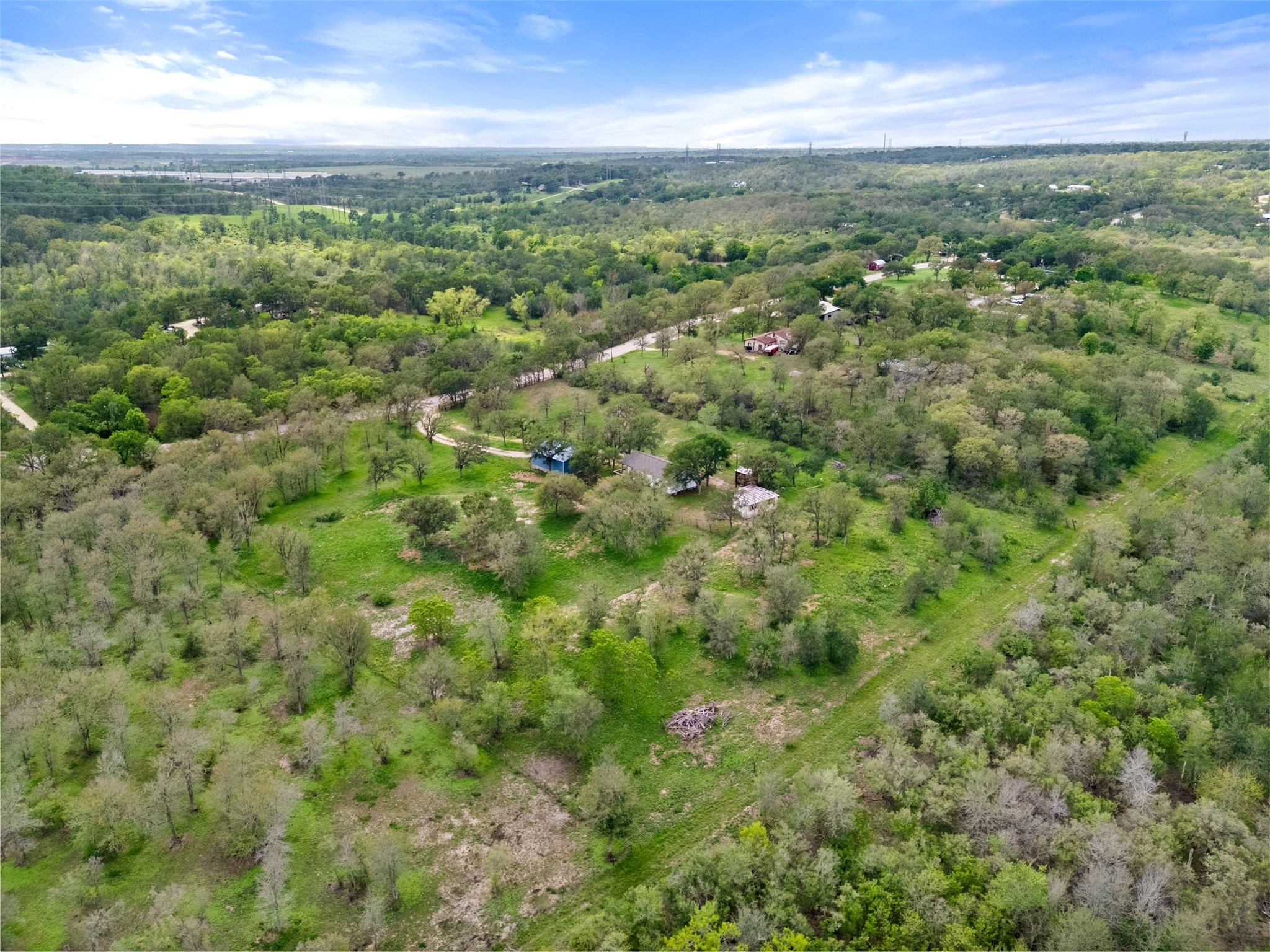 274 Old Austin Trail Elgin, TX 78621 - Photo 7 of 32 a view of a city with lush green forest