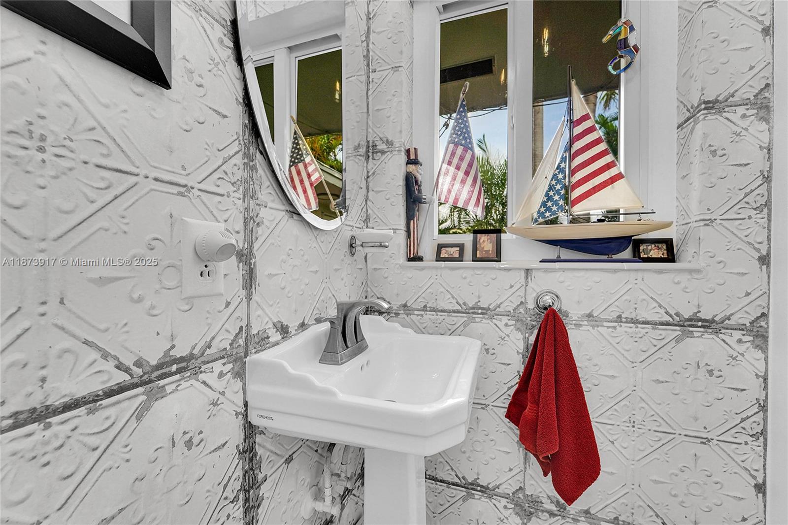 1431 South Ocean Boulevard, Unit 11 Lauderdale-by-the-Sea, FL 33062 - Photo 14 of 42 a bathroom with a sink and a mirror