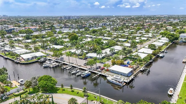 an aerial view of a house with a lake view