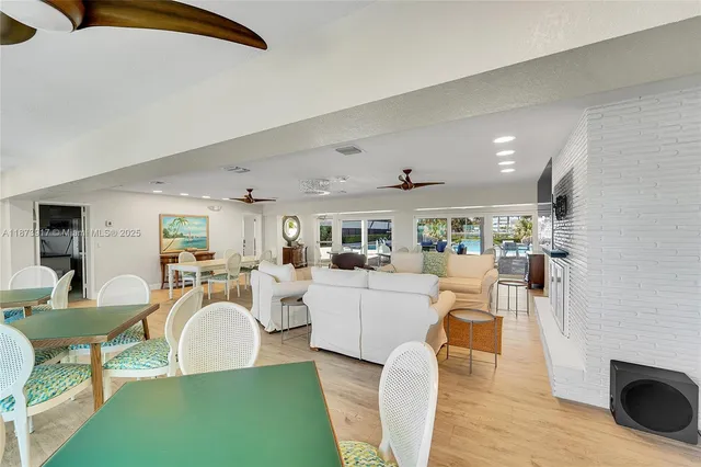 a living room with furniture a rug and a fireplace