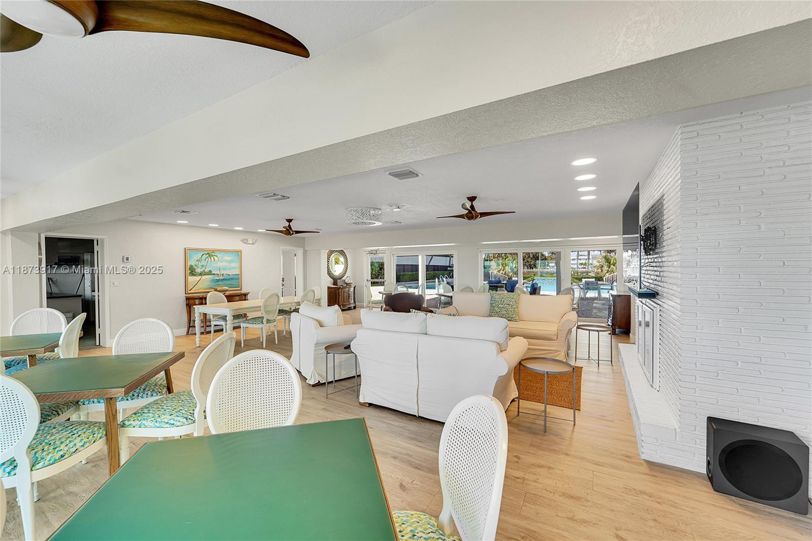 1431 South Ocean Boulevard, Unit 11 Lauderdale-by-the-Sea, FL 33062 - Photo 38 of 42 a living room with furniture a rug and a fireplace