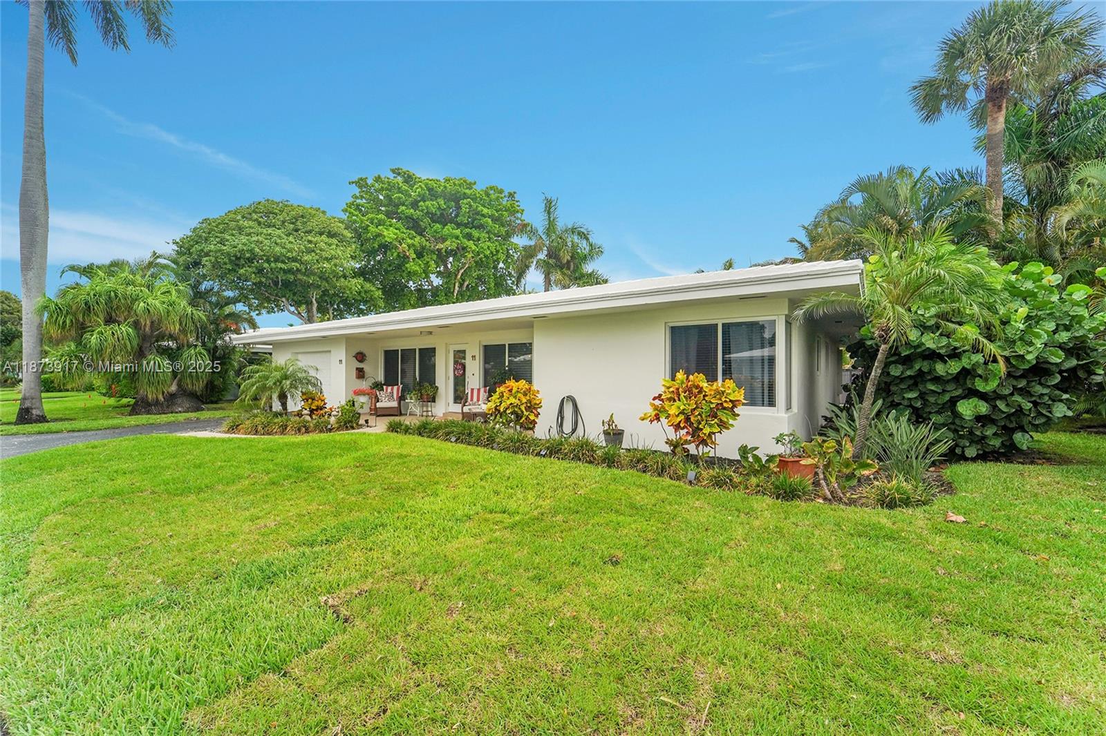 1431 South Ocean Boulevard, Unit 11 Lauderdale-by-the-Sea, FL 33062 - Photo 4 of 42 a front view of house with a garden