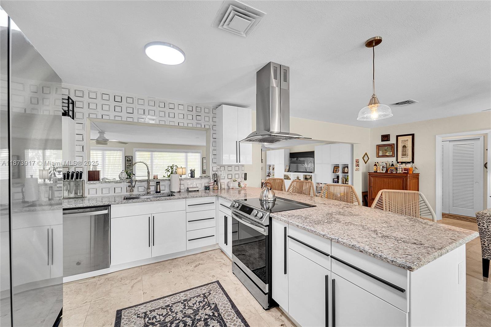 1431 South Ocean Boulevard, Unit 11 Lauderdale-by-the-Sea, FL 33062 - Photo 10 of 42 a kitchen with stainless steel appliances granite countertop a sink and stove