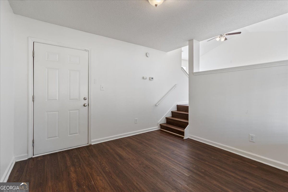 7132 New Dale Road Rex, GA 30273 - Photo 11 of 31 a view of an empty room with wooden floor
