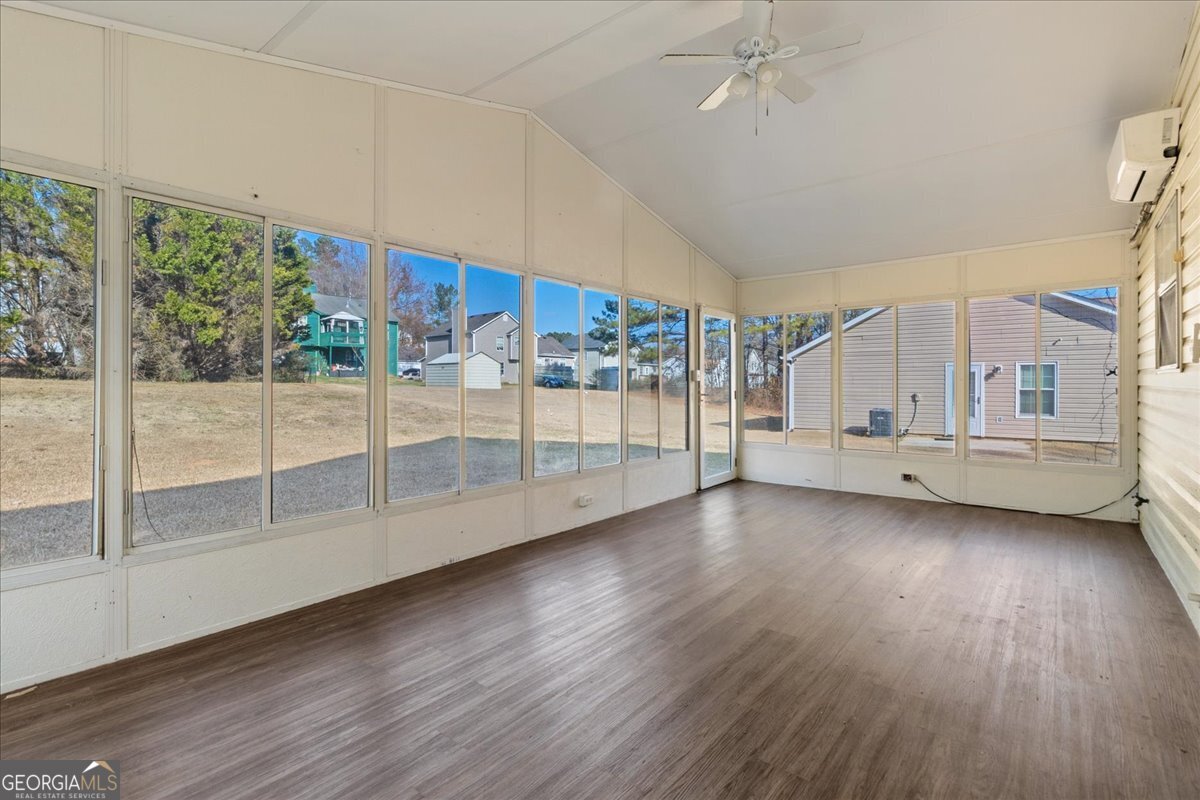 7132 New Dale Road Rex, GA 30273 - Photo 15 of 31 a view of a livingroom with wooden floor and white walls