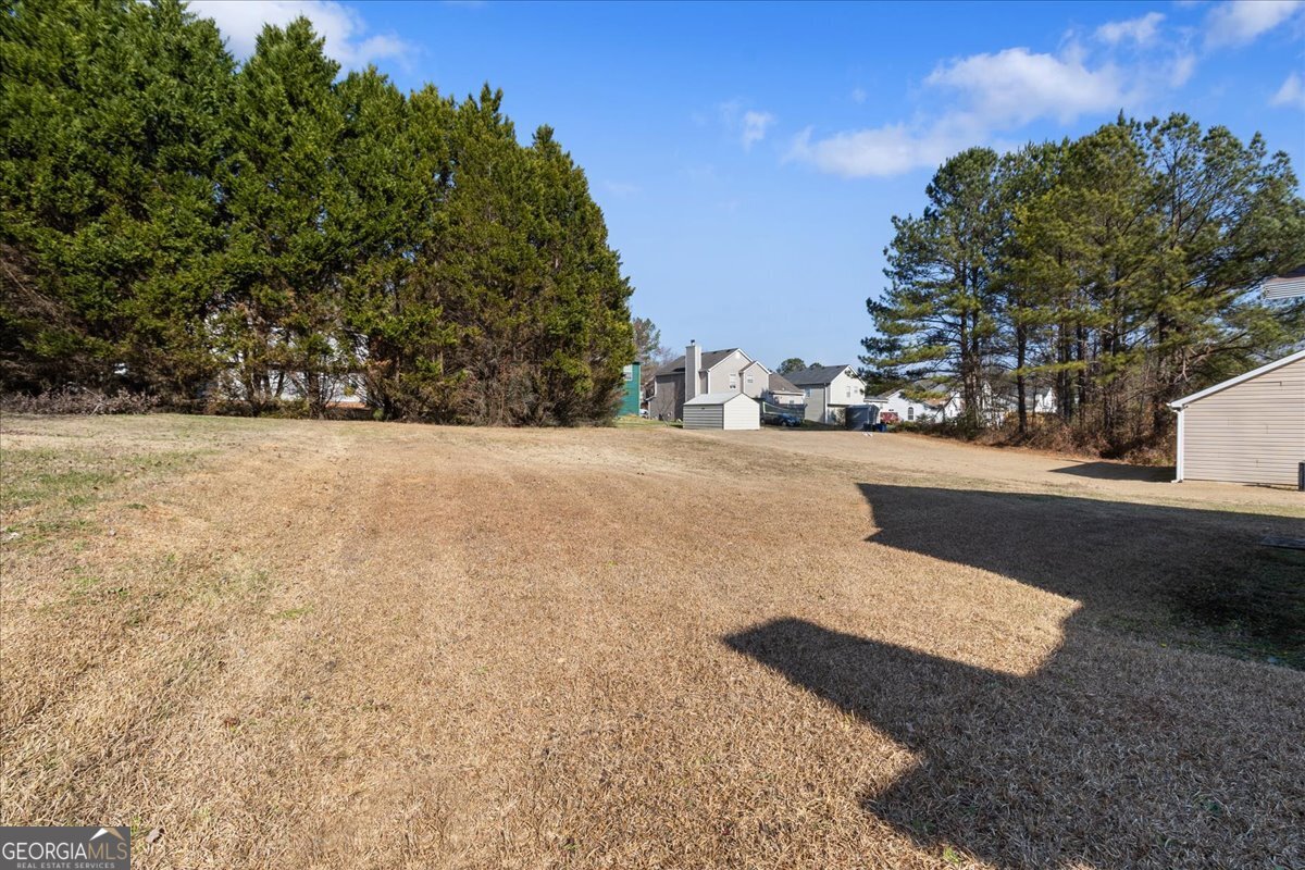 7132 New Dale Road Rex, GA 30273 - Photo 31 of 31 a view of a road with a building in the background