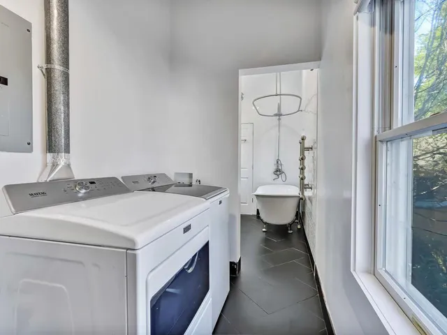 a utility room with dryer and washer