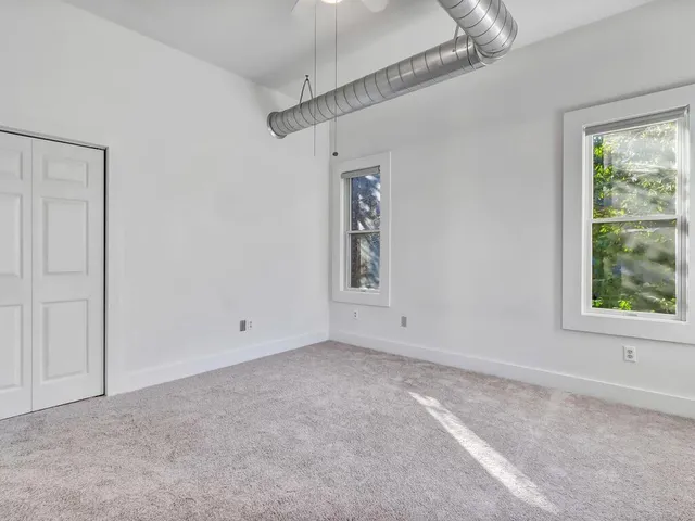 a view of a street with houses on both side