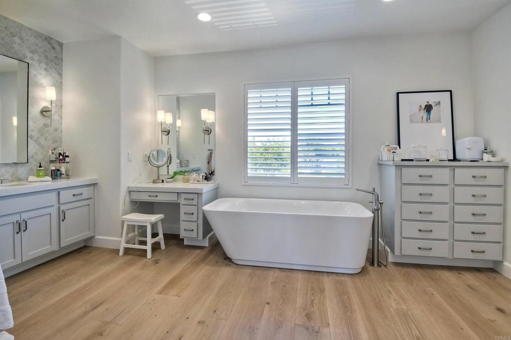 1475 Heritage Lane Encinitas, CA 92024 - Photo 11 of 28 a spacious bathroom with a double vanity sink mirror and a bathtub