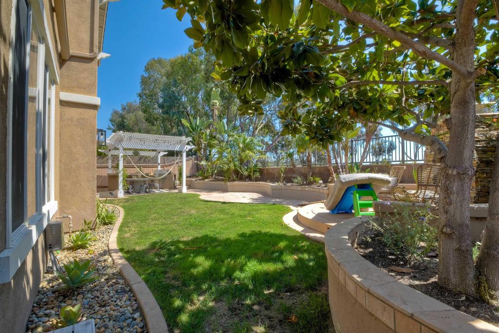1475 Heritage Lane Encinitas, CA 92024 - Photo 14 of 28 a view of a backyard with garden