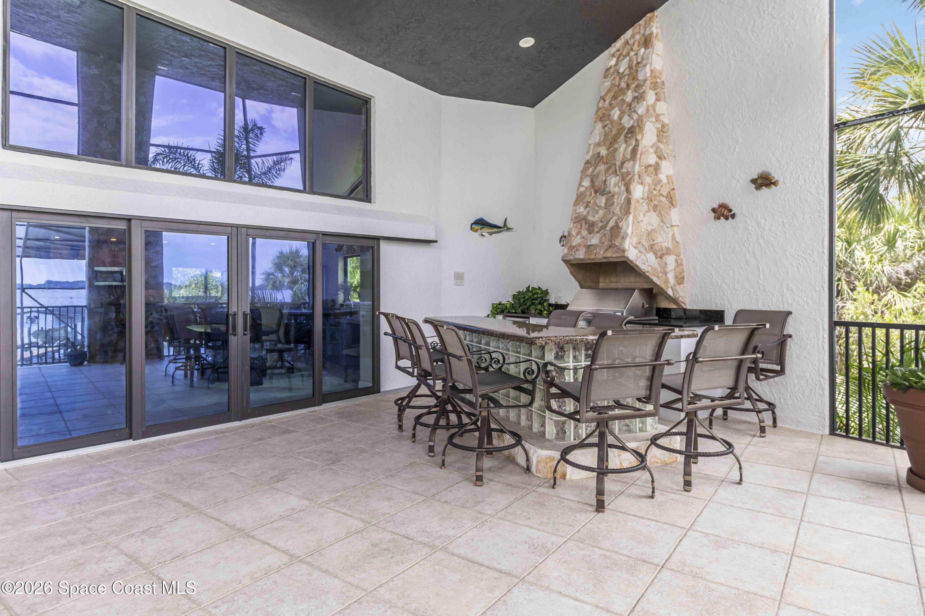 110 Barnacle Place Rockledge, FL 32955 - Photo 29 of 71 a view of a dining room with furniture and chandelier