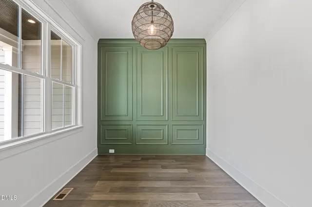 a view of hallway with wooden floor