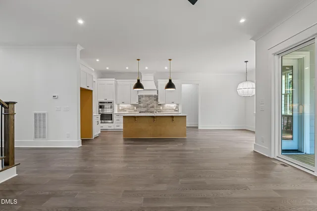 a stove top oven sitting inside of a kitchen