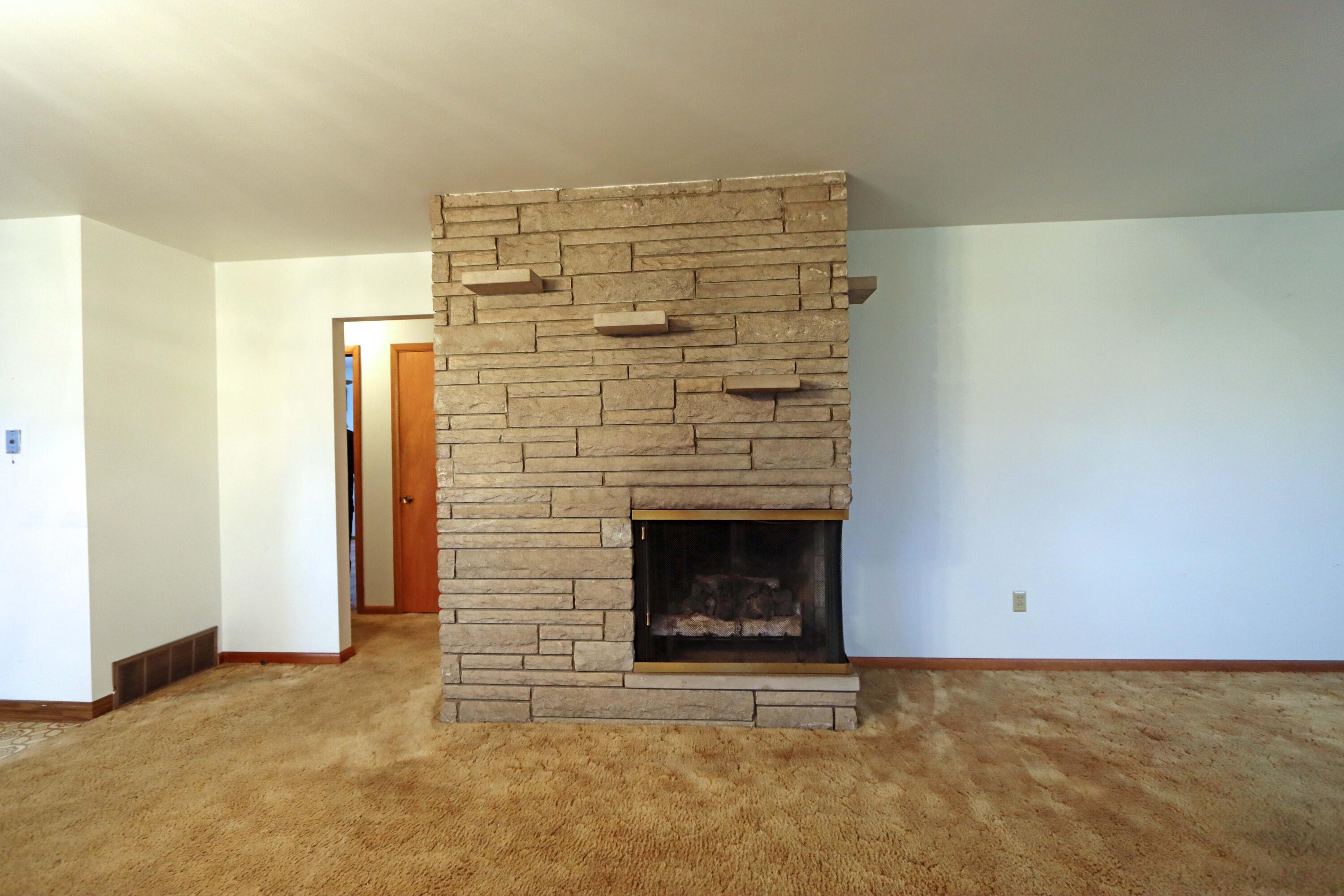 3761 Snouffer Road Columbus, OH 43235 - Photo 6 of 39 Vintage limestone fireplace