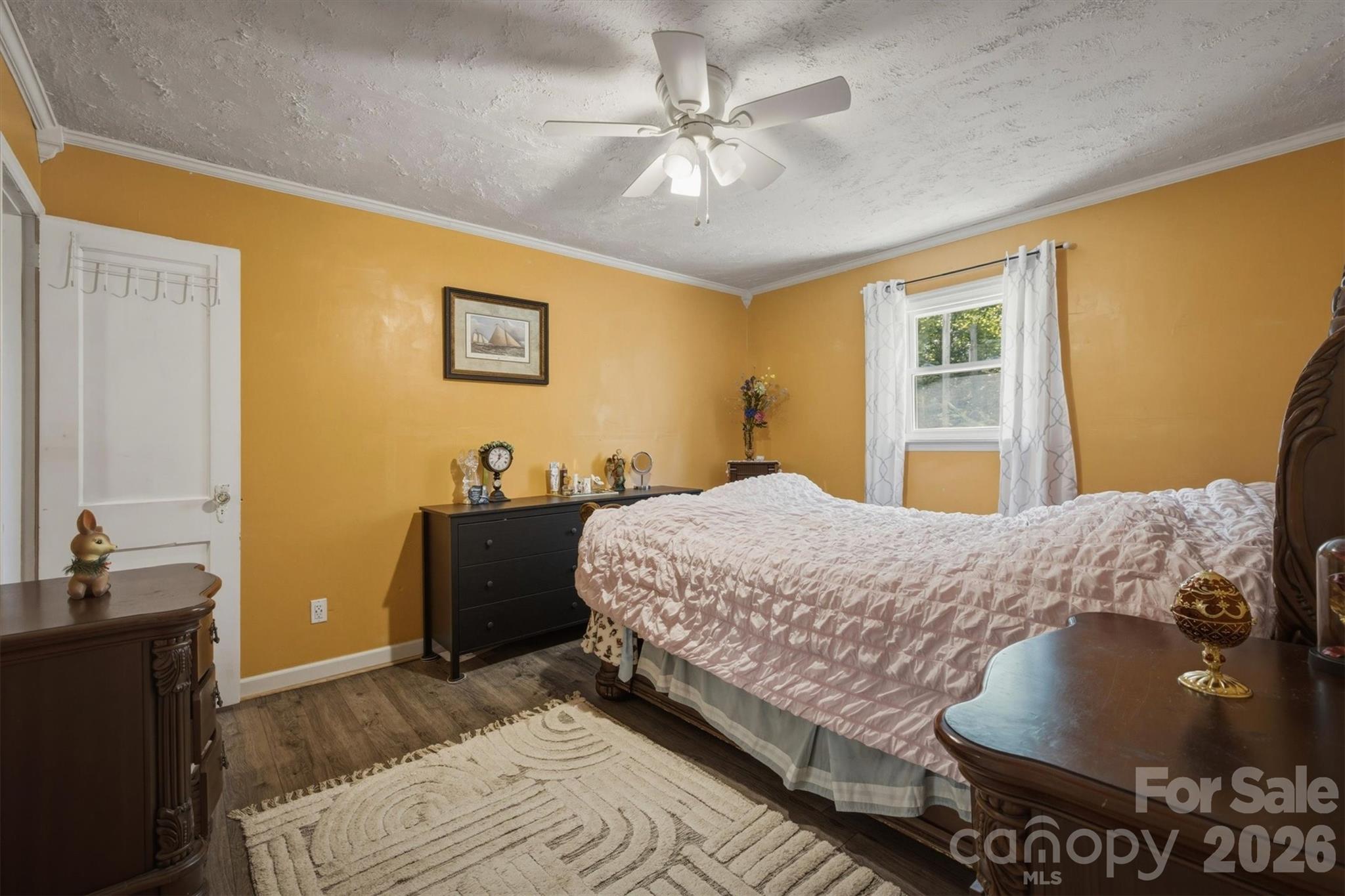 3153 Faith Temple Church Road Morganton, NC 28655 - Photo 10 of 24 a bedroom with a bed and a chandelier