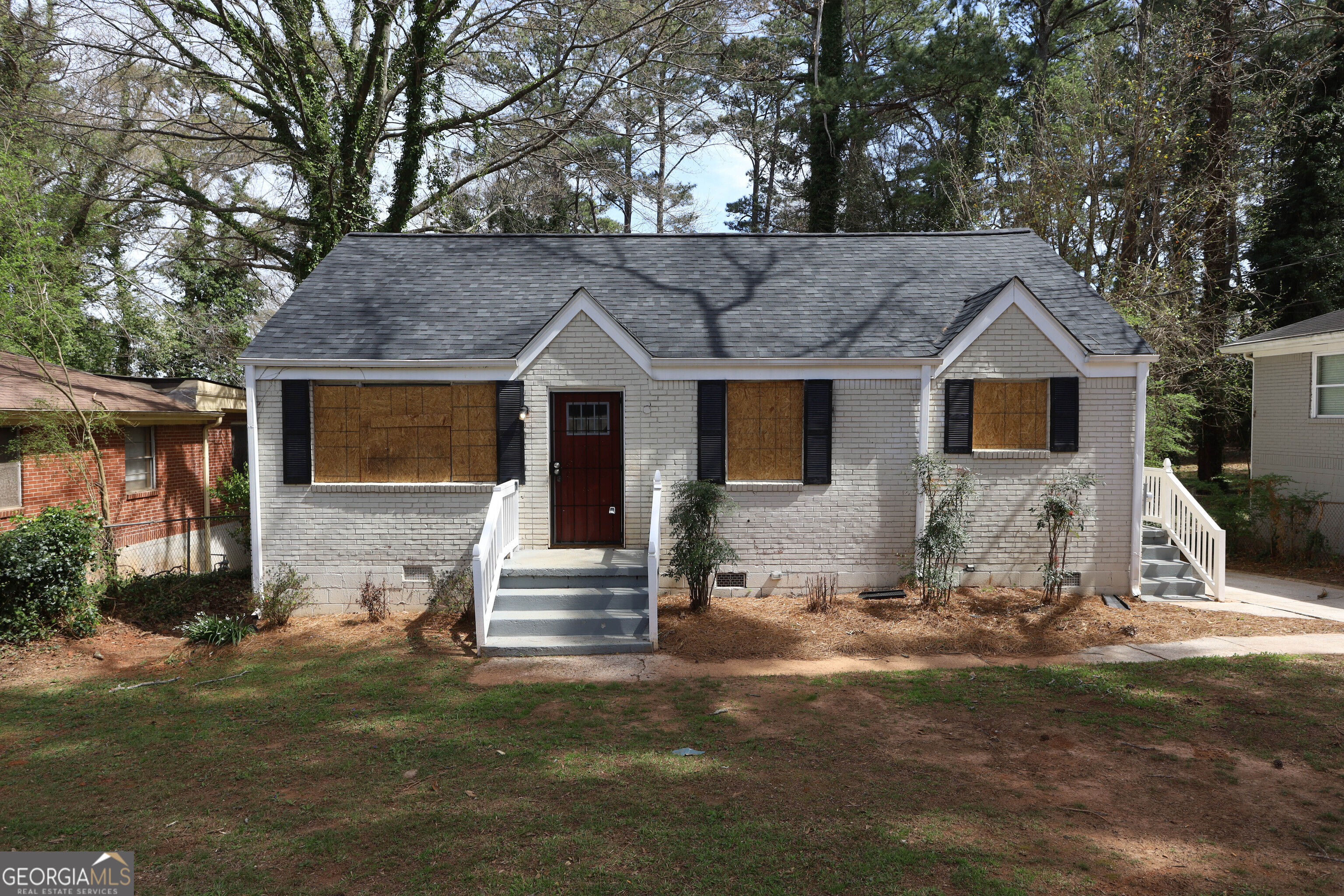 a front view of a house with a yard