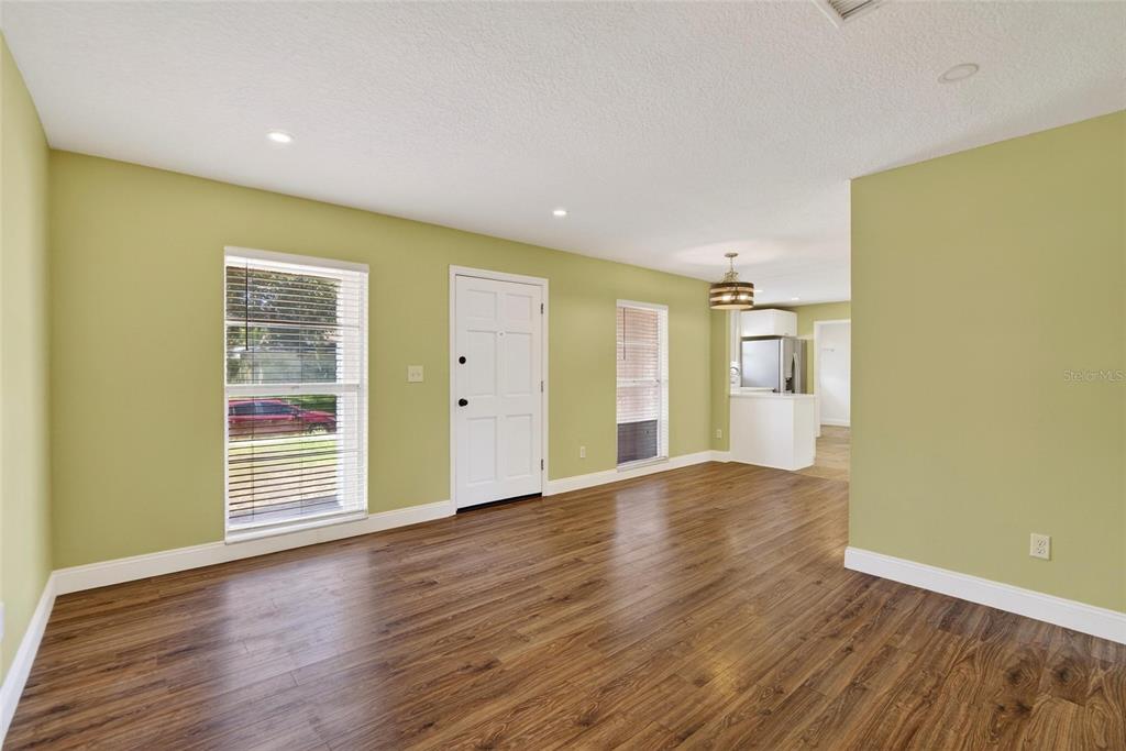 2340 Merrily Circle South Seffner, FL 33584 - Photo 36 of 52 a view of wooden floor and windows in a room