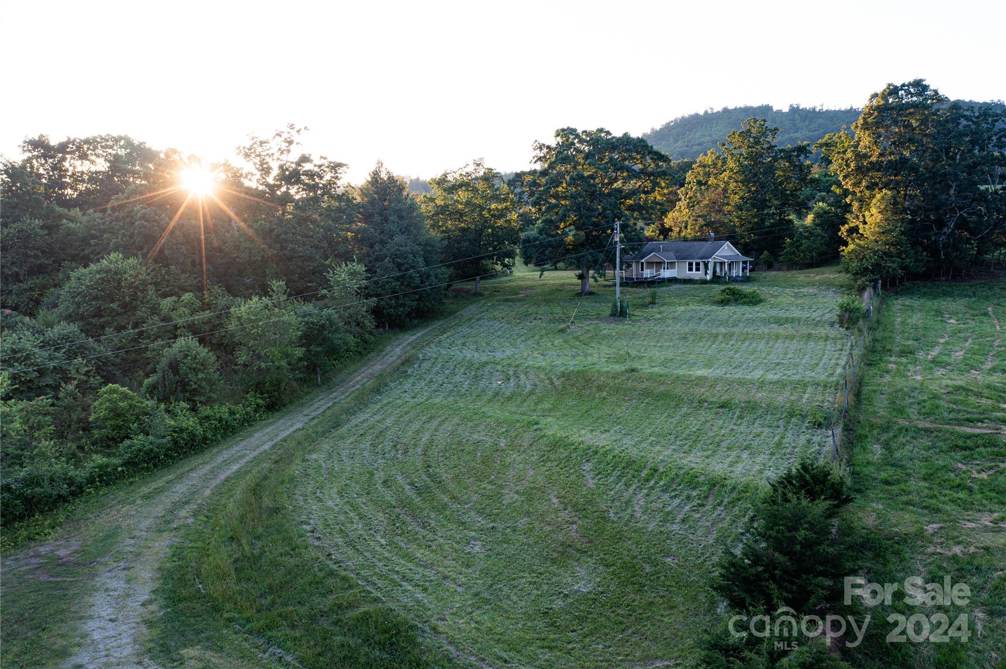 931 Waters Road Bostic, NC 28018 - Photo 1 of 22 a view of a tiny house with a yard