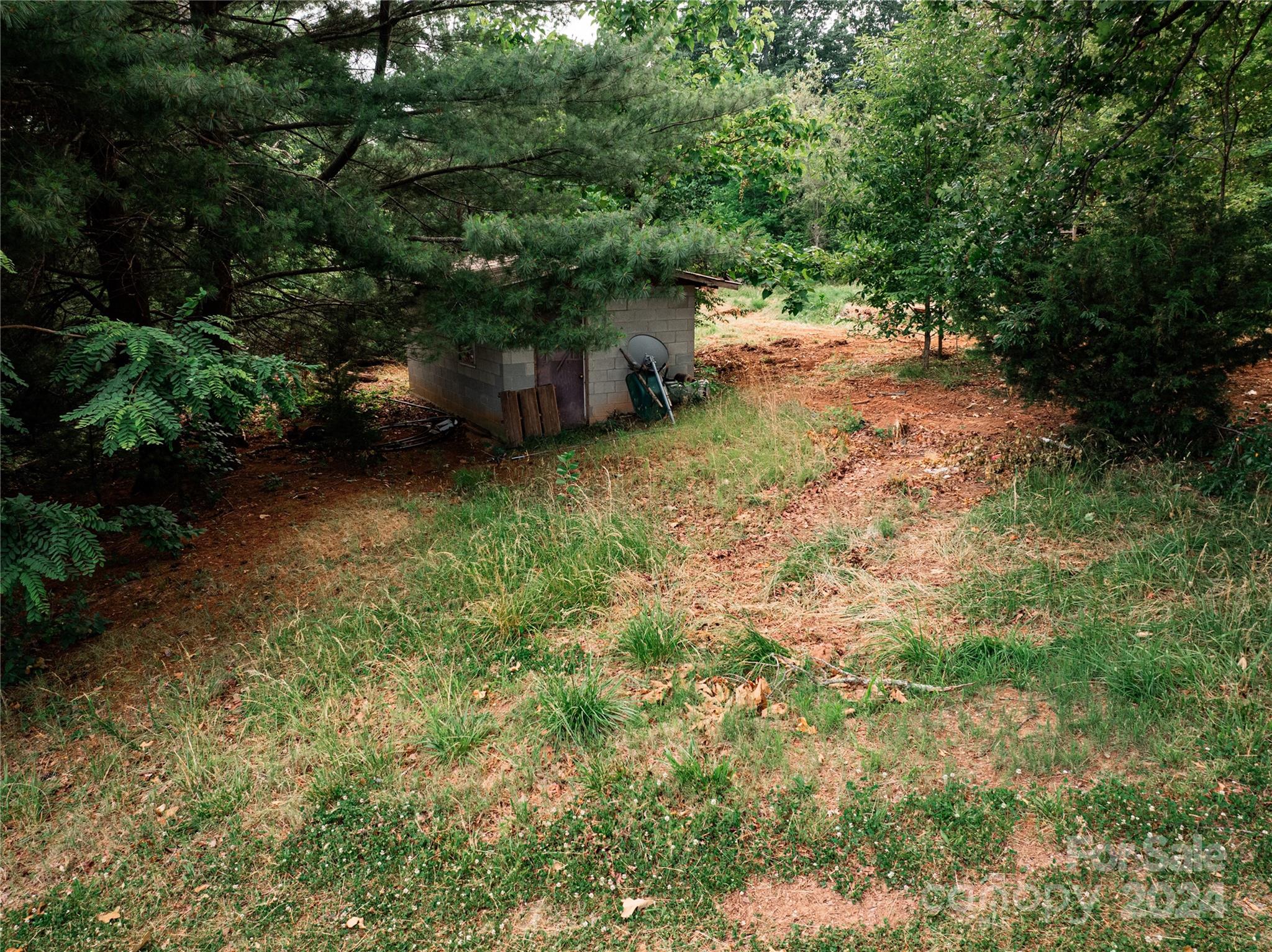 931 Waters Road Bostic, NC 28018 - Photo 14 of 22 a backyard of a house with a yard and outdoor seating