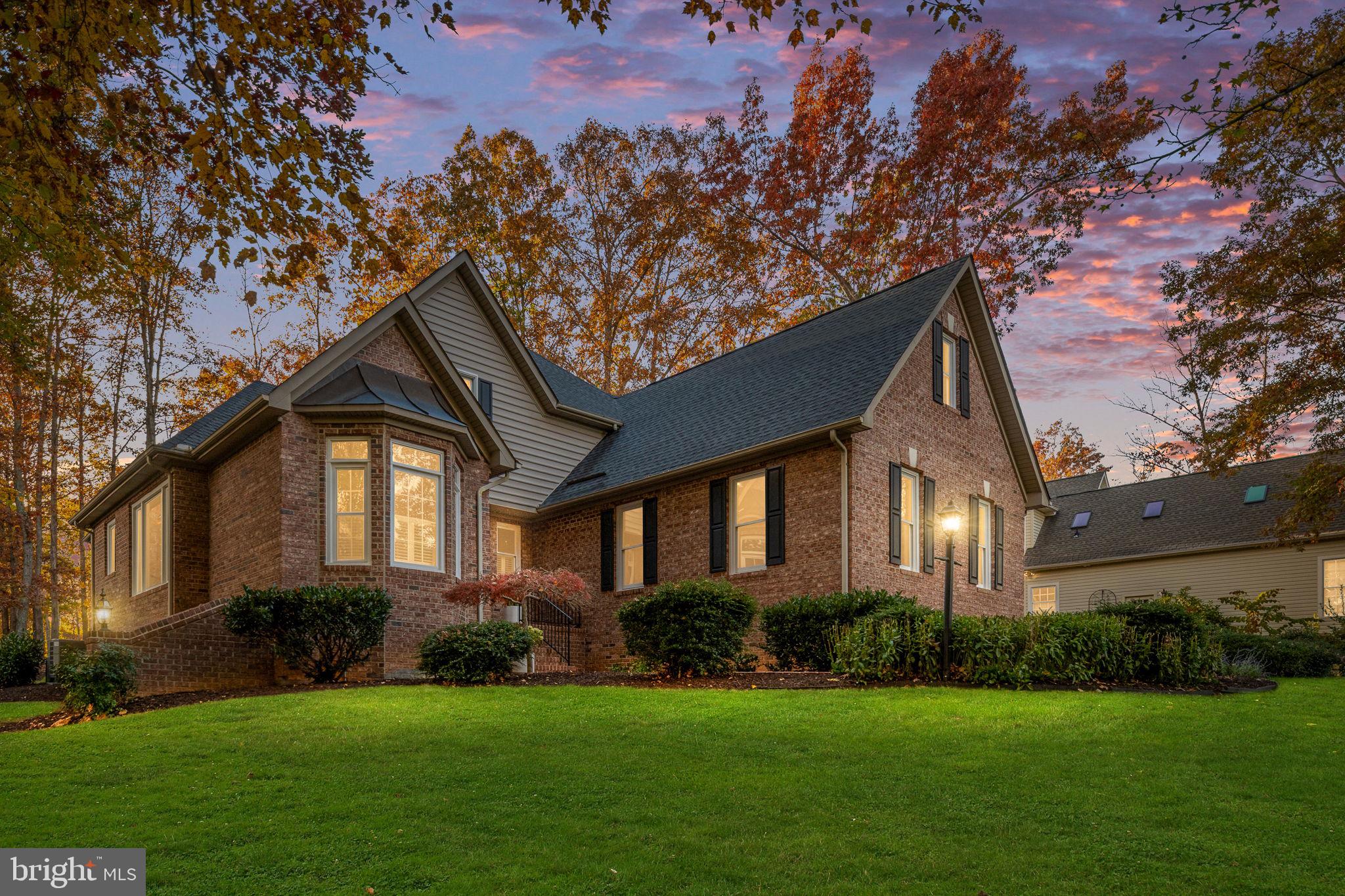 10816 Chatham Ridge Way Spotsylvania, VA 22551 - Photo 2 of 101 a front view of a house with a yard and garage