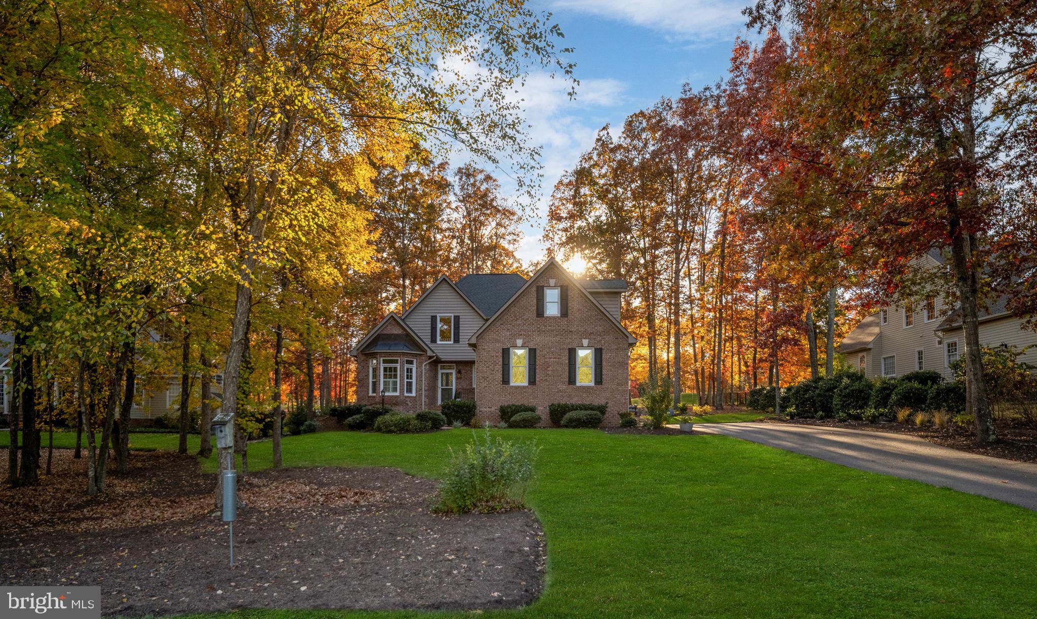 10816 Chatham Ridge Way Spotsylvania, VA 22551 - Photo 3 of 101 a front view of a house with a garden
