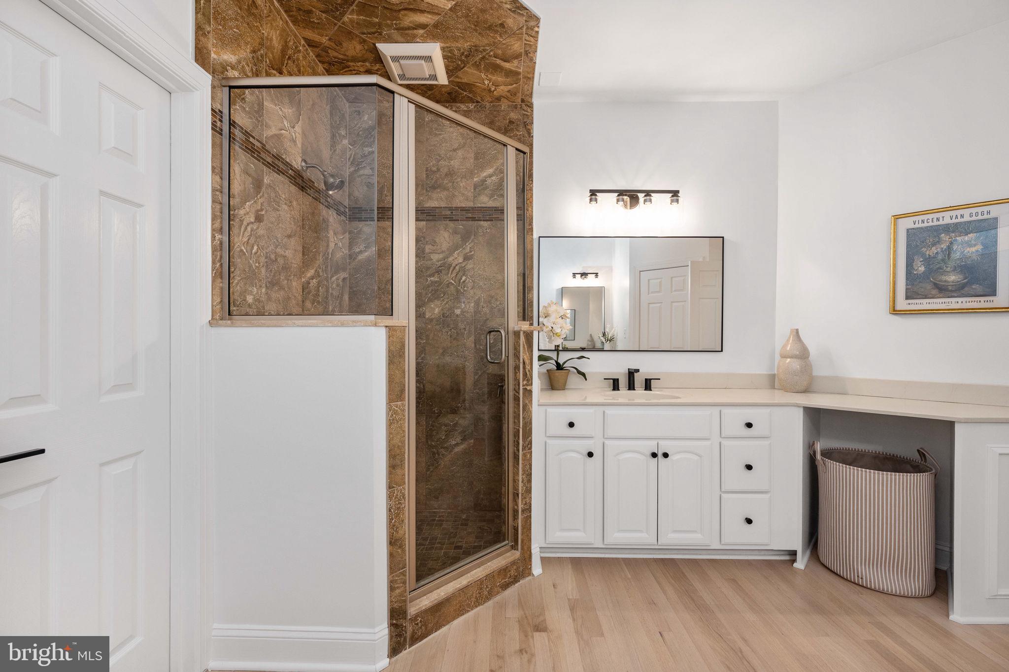 10816 Chatham Ridge Way Spotsylvania, VA 22551 - Photo 36 of 101 a spacious bathroom with a double vanity sink and a mirror