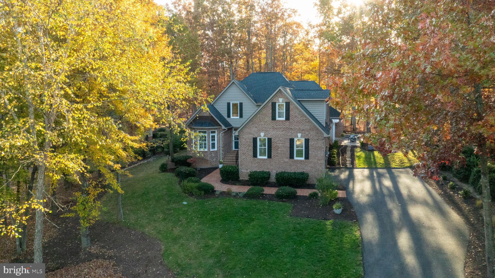 10816 Chatham Ridge Way Spotsylvania, VA 22551 - Photo 6 of 101 a front view of a house with yard and green space
