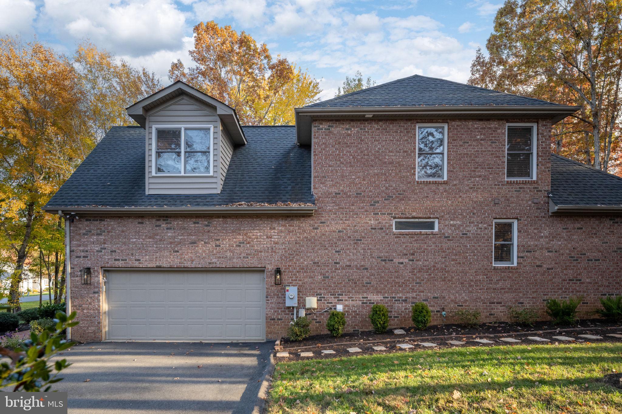 10816 Chatham Ridge Way Spotsylvania, VA 22551 - Photo 68 of 101 a front view of a house with a garden