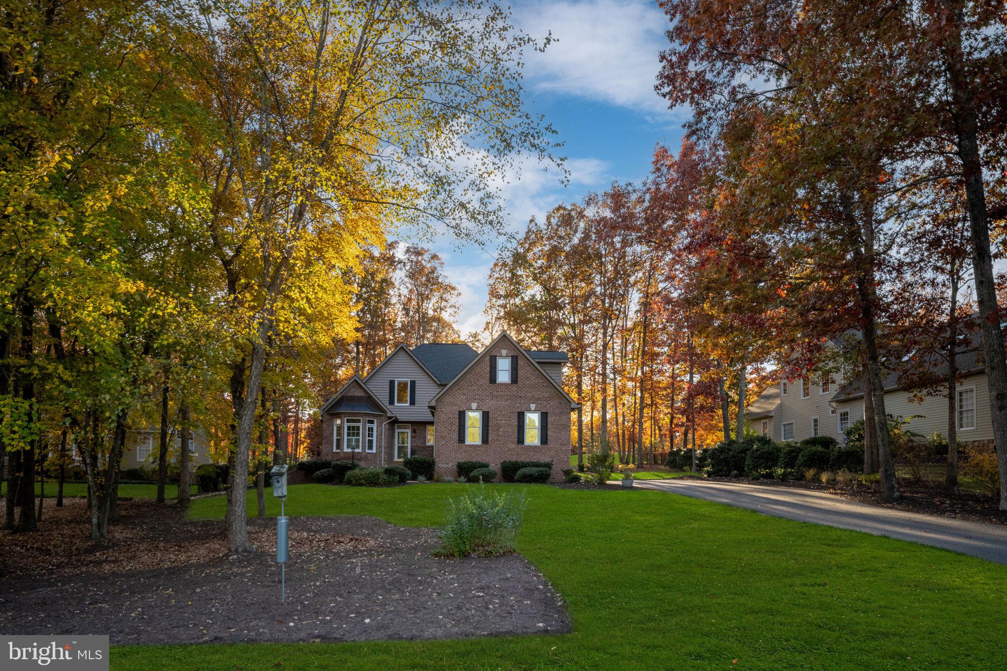 10816 Chatham Ridge Way Spotsylvania, VA 22551 - Photo 72 of 101 a front view of a house with garden
