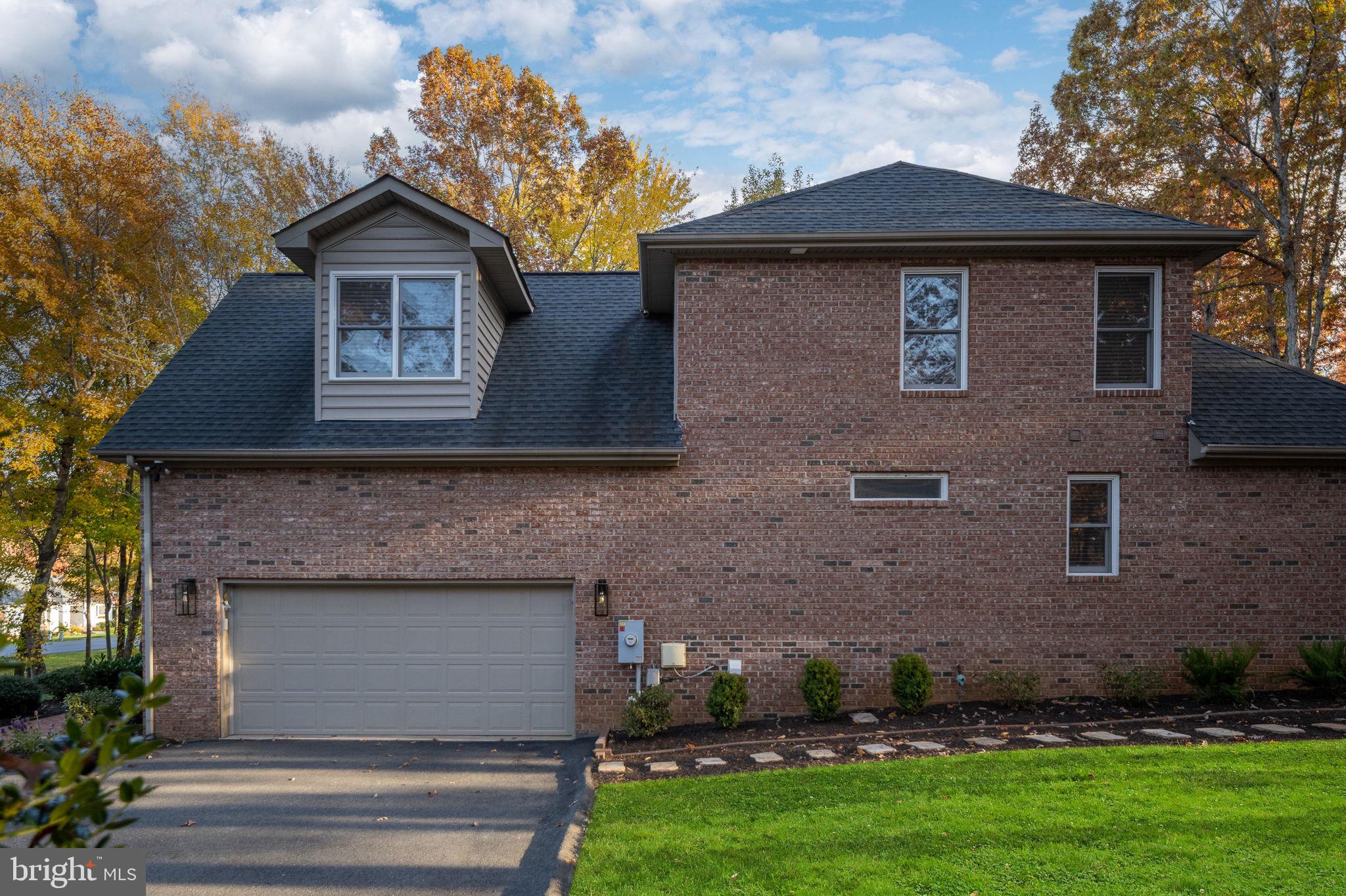 10816 Chatham Ridge Way Spotsylvania, VA 22551 - Photo 73 of 101 a front view of a house with a garden