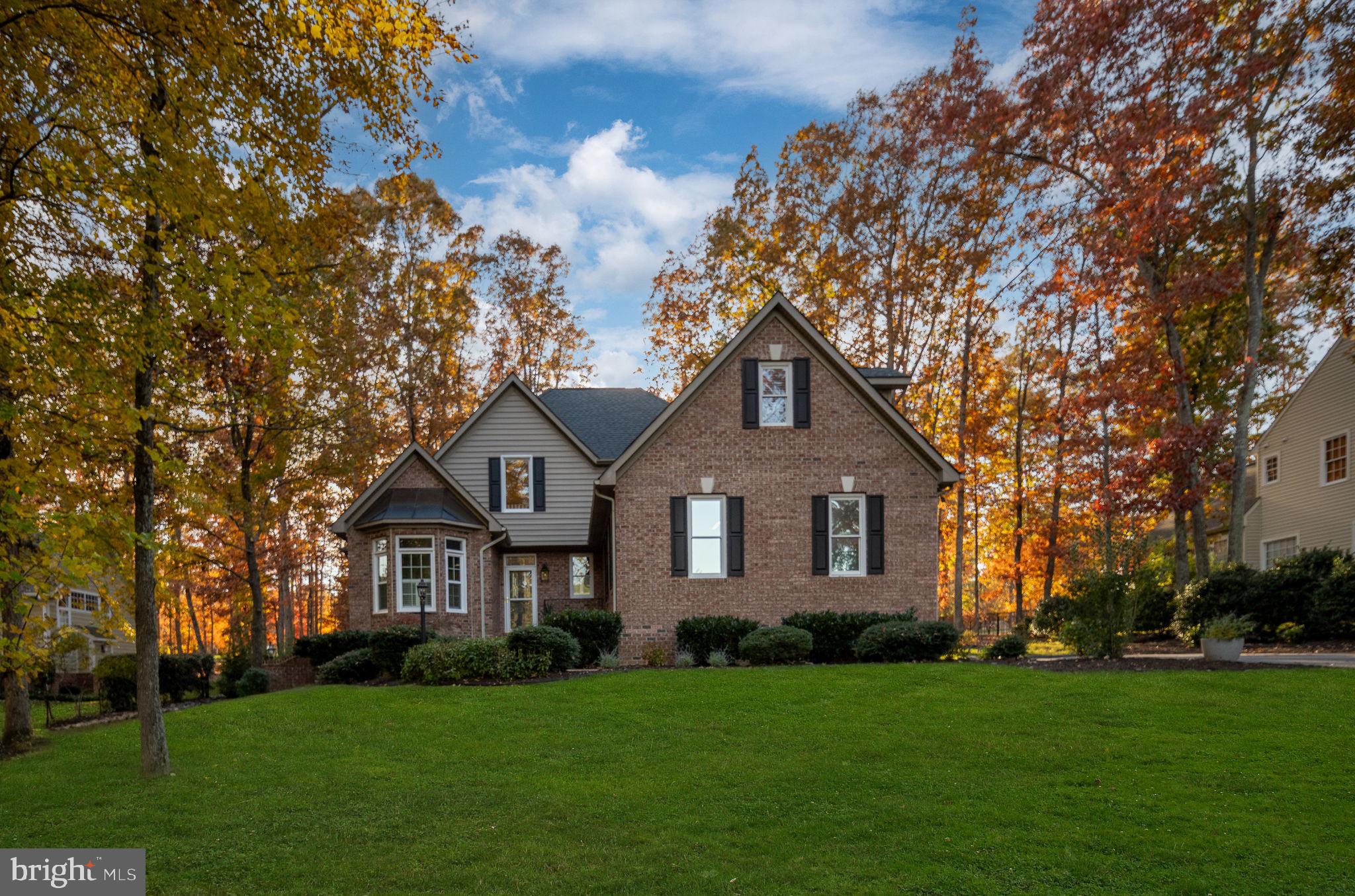 10816 Chatham Ridge Way Spotsylvania, VA 22551 - Photo 75 of 101 a front view of a house with a garden