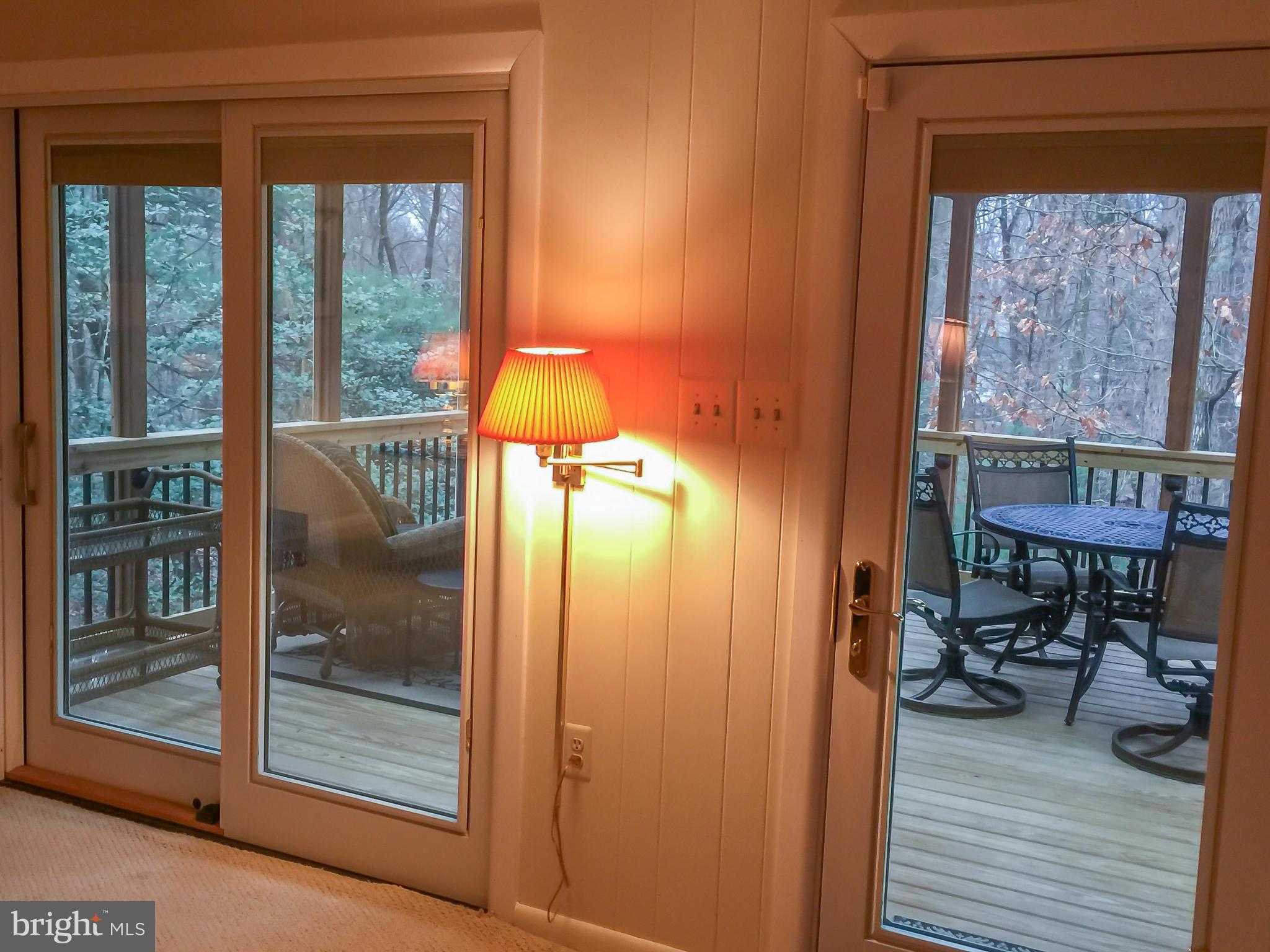 11423 Running Cedar Road Reston, VA 20191 - Photo 11 of 28 a view of a porch with a table and chairs