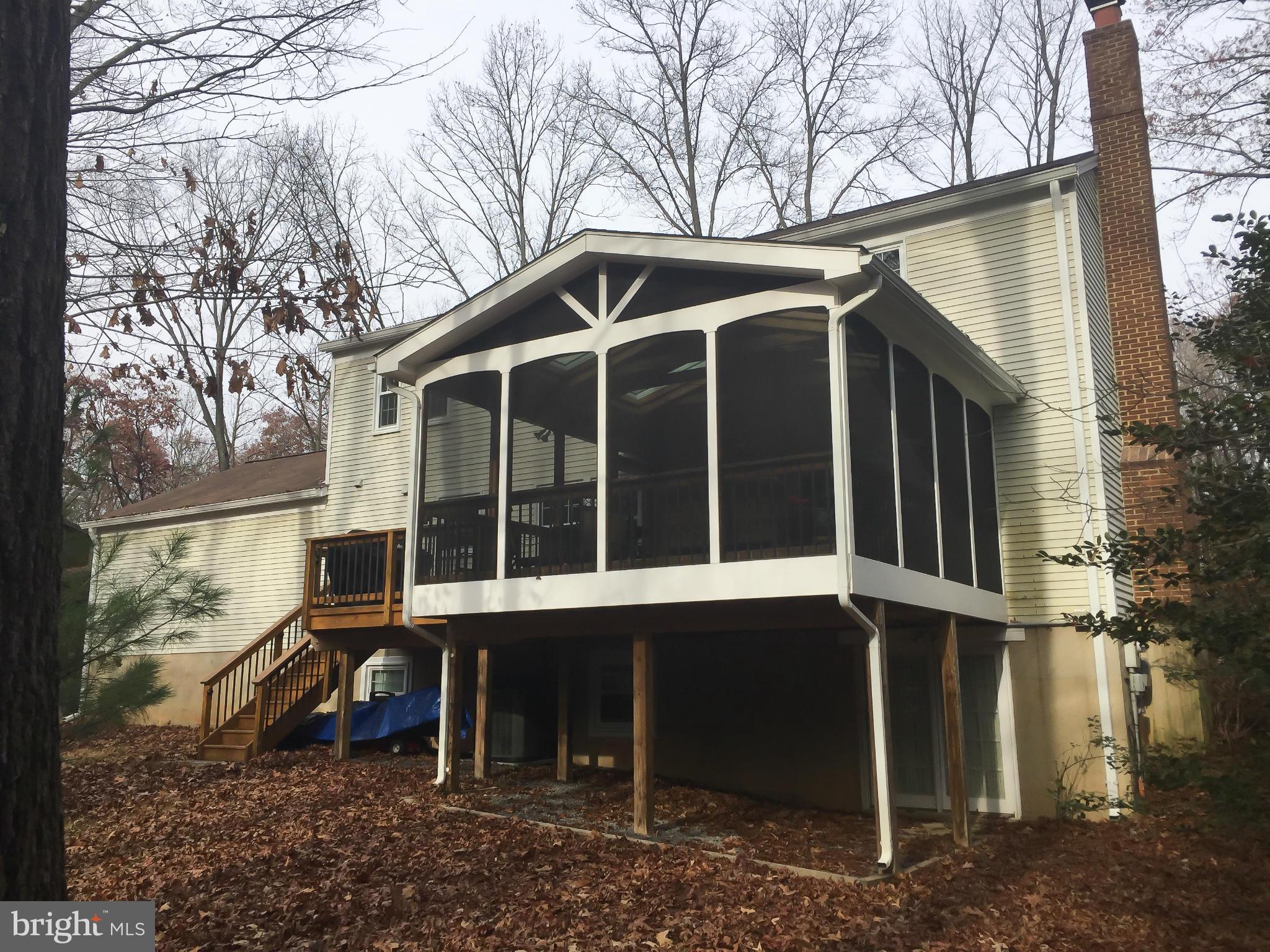 11423 Running Cedar Road Reston, VA 20191 - Photo 15 of 28 a view of wooden house with a large window and wooden fence