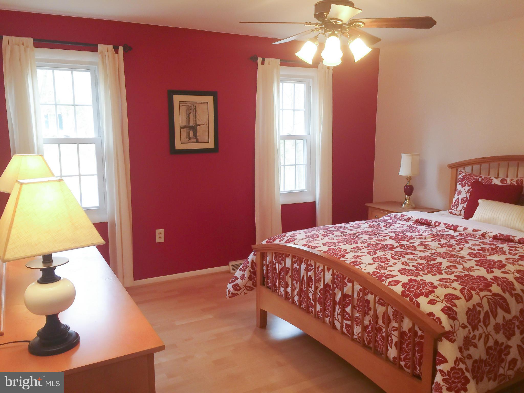 11423 Running Cedar Road Reston, VA 20191 - Photo 20 of 28 a bedroom with a bed and a window