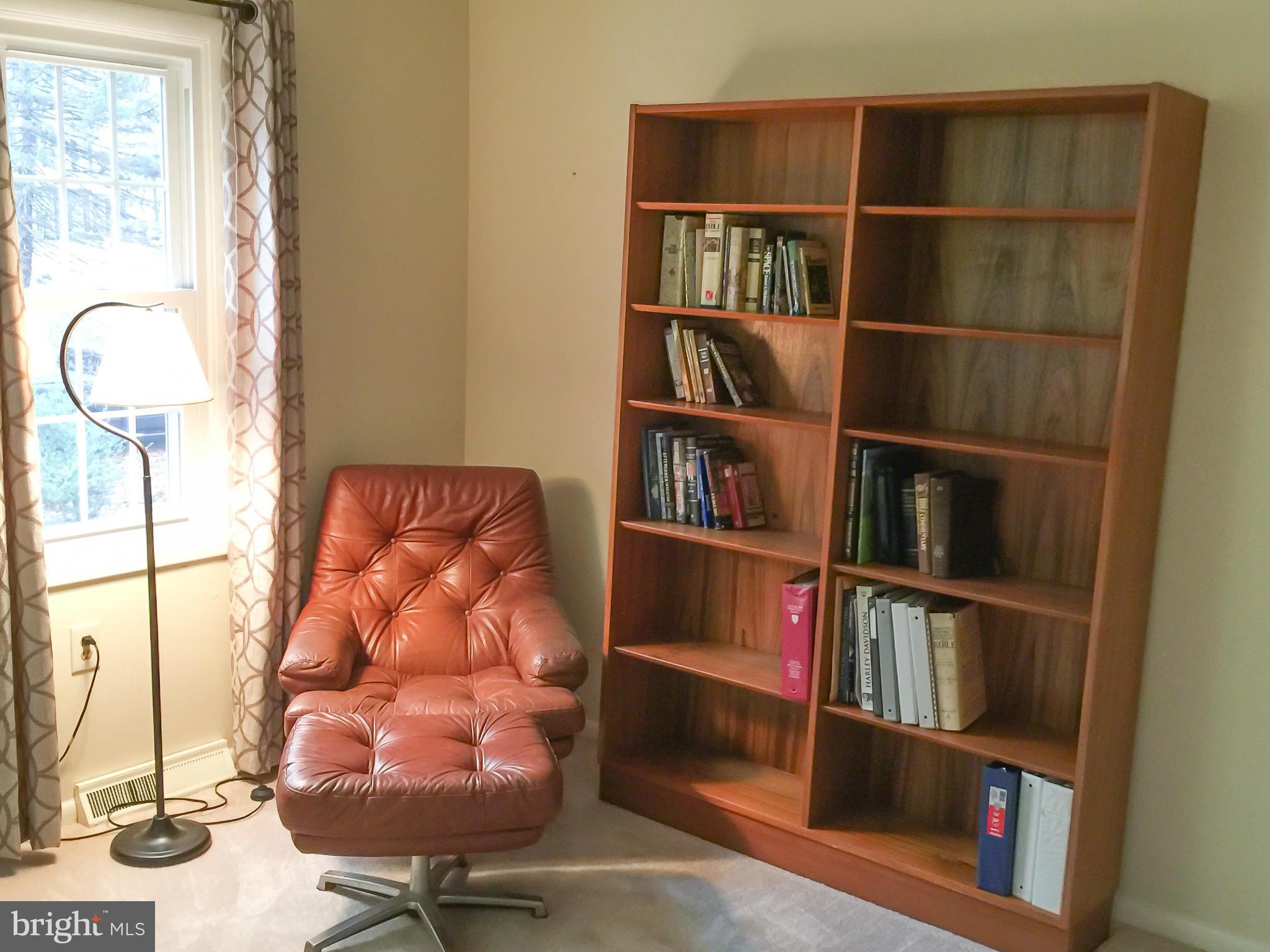 11423 Running Cedar Road Reston, VA 20191 - Photo 22 of 28 a room with book shelf and a window